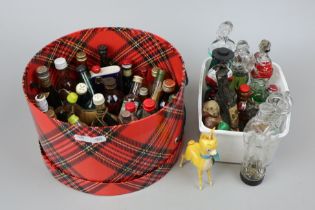 Collection of miniatures together with empty unusual shaped bottles