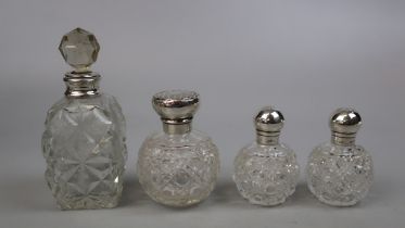 4 hallmarked silver topped bottles