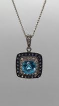 Blue topaz and coloured CZ pendant on chain