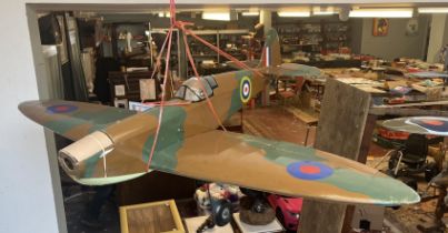 Radio controlled model of a Spitfire with servers. Wing width 142cm, length of fuselage 107cm