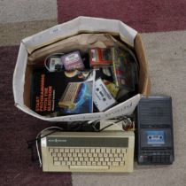 Acorn electron computer together with cassette player and cassette games