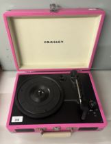 Cased record player, by Crosley