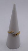 18ct gold 2 stone diamond twist ring - Size O