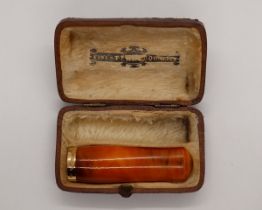 Amber cheroot/cigarette holder with 9ct gold band in original fitted case