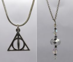 2 silver necklaces with pendants