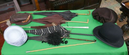 Collection of ladies hats together with vintage parasols