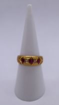 18ct gold 5 stone diamond and ruby ring