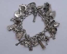 Silver charm bracelet - Approx 80g