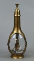 Interesting brass and glass decanter with cup acting as lid