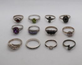 12 silver stone set rings