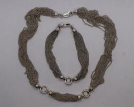 Silver necklace with matching bracelet