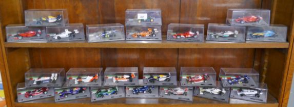 Collection of Formula 1 model diecast cars in cases