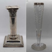 Silver candlestick together with a silver topped bud vase