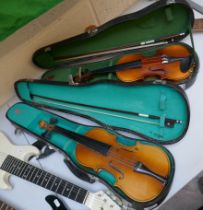 2 violins in cases