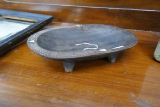 Carved tribal wooden bowl inlaid with mother-of-pearl and carved from a single piece