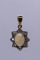 9ct gold opal and diamond pendant