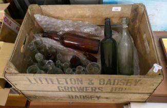 Collection of vintage bottles in a Littleton Badsey crate