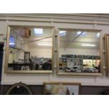 A pair of modern gilt framed wall mirrors