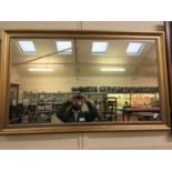 A gilt framed rectangular mirror