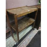 A mid-20th century oak two tier tea trolley