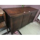 A mid-20th century oak panelled coffer