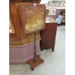 A Victorian rosewood face screen having a needlework under glass