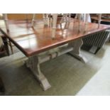 A white painted refectory table with a five plank oak top