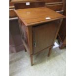 An Edwardian mahogany and rosewood banded pot cupboard