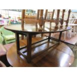 A high quality reproduction oak drop leaf occasional table