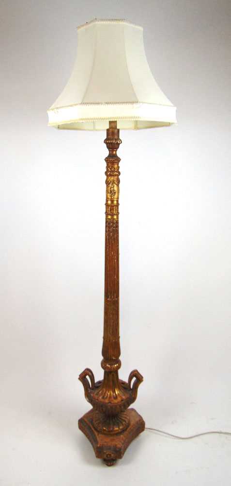 A late 19th century French giltwood standard lamp, the carved and fluted column on triform base,