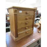 A waxed pine chest of five drawers of small proportions