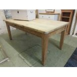 A pine kitchen table with drawer to side