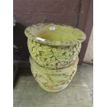 Two composite stone garden pots with floral design