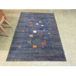 A modern blue ground rug with animal motif