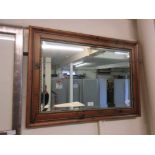 A modern pine framed bevel glass mirror