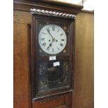 An early 20th century American drop-dial wall clock