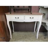 A white painted two drawer console table