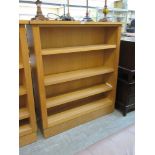 A modern light oak bookcase