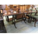 A mahogany drop-leaf dining table