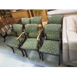 A set of five plus one Regency style dining chairs upholstered in a green cut fabric