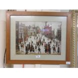 A framed and glazed Lowry printDoesn't appear to be a limited edition print.