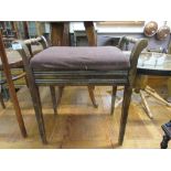 An early 20th century walnut music stool
