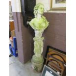 A composite stone garden ornament in the form of a classical lady bust on three grace pillar