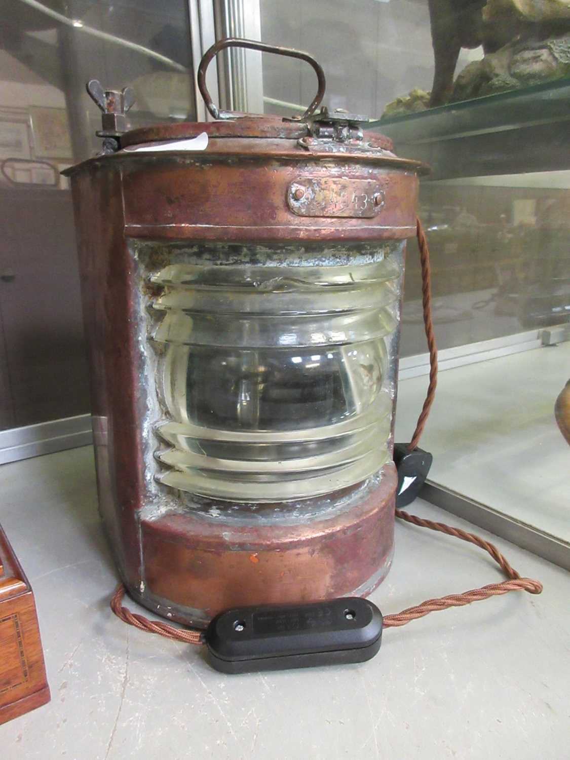 A copper ship's lamp later converted to electricity