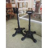 A pair of cast iron table bases