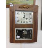 An early 20th century oak cased drop dial wall clock by Cavalie
