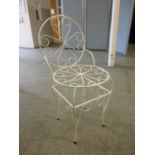 A white painted metalwork chair