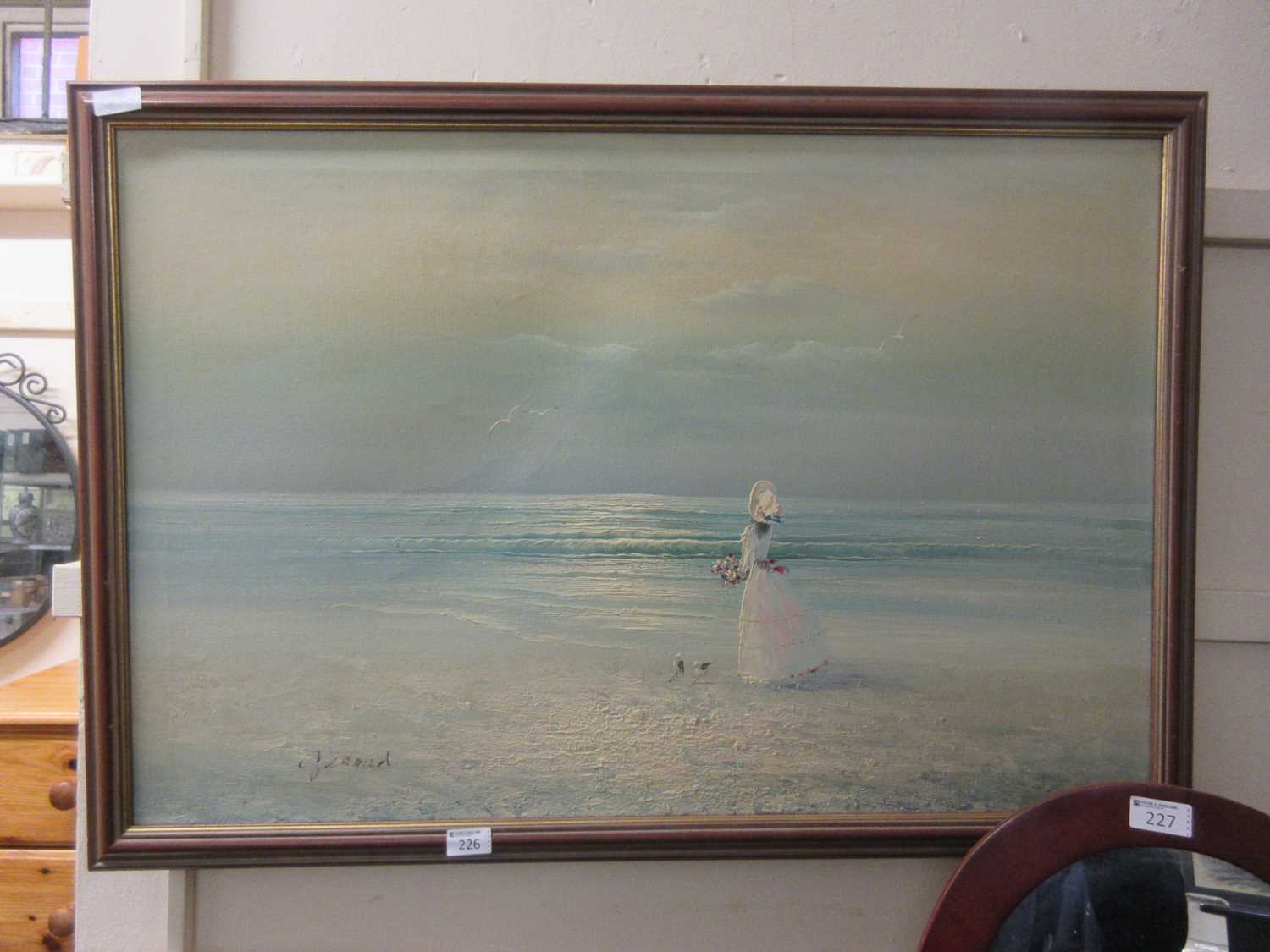 A modern framed oil on canvas of girl in coastal scene signed bottom left