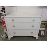 A white painted chest of three drawers