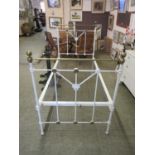 A cream painted and brass single bedframe